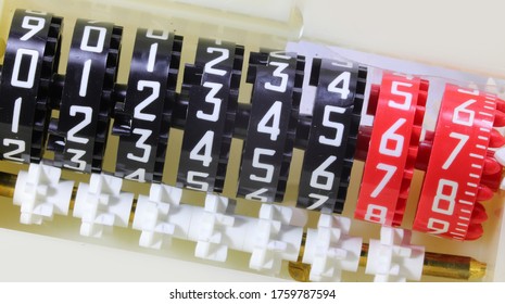 Detail of big numbers of an analog meter for detecting the consumption of the user - Powered by Shutterstock - Get 15% off with code: PIKWIZARD15