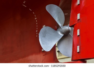 Detail of black stern and close up ship propeller rudder in floating dock under maintenance and repair already, after sandblasting and painting approved and witnessed by surveyor in shipyard 