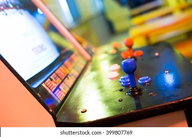  Detail Of A Blue Joystick And Buttons On An Old Arcade Game In A Gaming Room