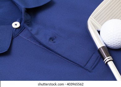 Detail Of Blue Polo Shirt And Golf Equipments