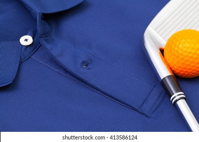 Detail Of Blue Polo Shirt And Golf Equipments