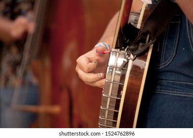 Detail Of Bluegrass Musicians Performing At A Festival. Banjo And Double Bass.