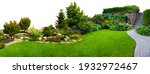 Detail of a botanical garden isolated on white background. Garden stone path with grass growing up between the stones.