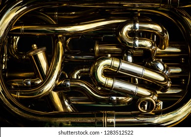 Detail Of The Brass Pipes Of A Tuba. Closeup Of The Central Section