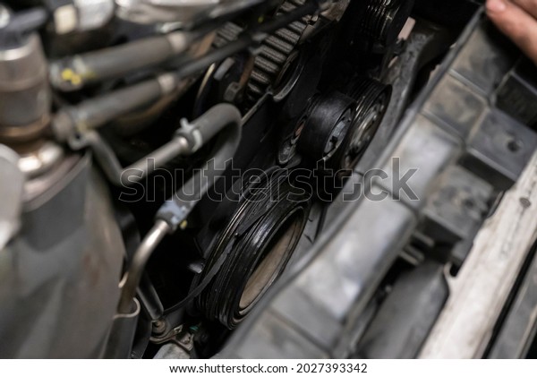Detail of Broken belt in\
the car engine