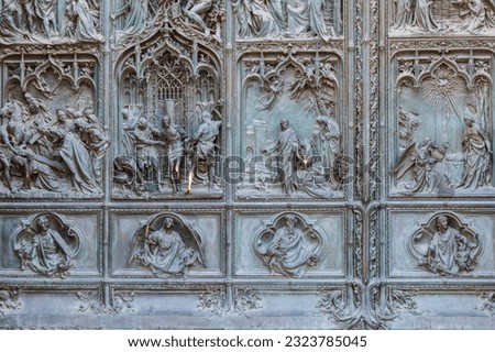 Detail of a bronze door of Milan cathedral, Italy
