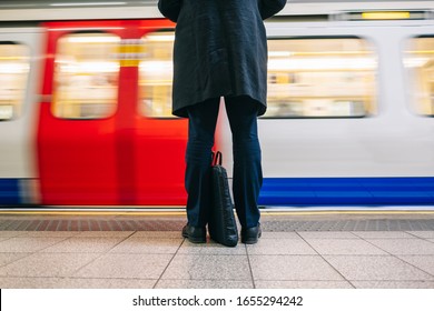 Detail Of A Business Man With A Briefcase Waiting For Public Transport Or Subway Train