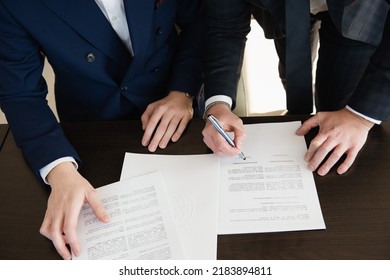 Detail Of Business Meeting - Signature Licences, Detail Of Hands, Close Up Business Man Reaching Out Sheet With Contract Agreement Proposing To Sign.Full And Accurate Details, 