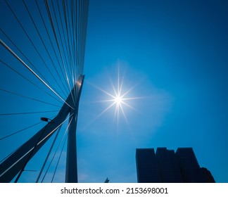 A Detail Of A Cable Bridge In Rotterdam Centre And A Sunburst - Sun Star On The Sky