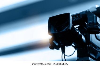 Detail of camera recording at a press conference
