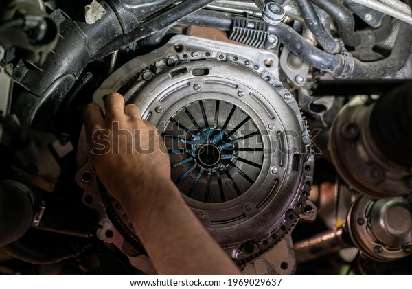 Detail of Car clutch assembly in a workshop, car\
reparation engine