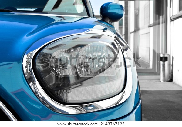 Detail of car headlights lamp, blue modern a luxury\
car front lamp