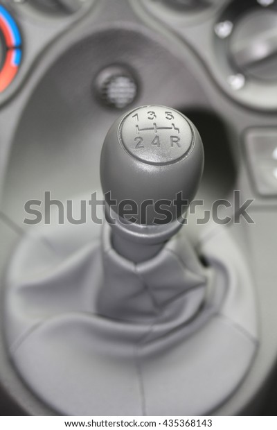 detail of a car\
interior, stick shift\
car
