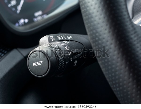 Detail of car lamp controlling signal switch\
control stick at steering\
wheel.