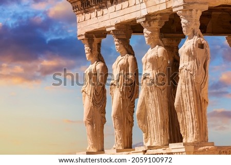 Detail of Caryatid Porch on the Acropolis uring colorful sunset in Athens, Greece. Ancient Erechtheion or Erechtheum temple. World famous landmark at the Acropolis Hill