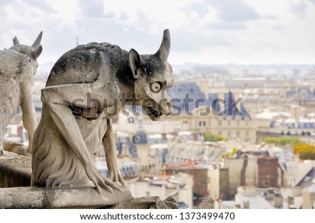 Detail of a Chimera sculpture (often confused with a Gargoyle), in Notre-Dame Cathedral, in Paris, France