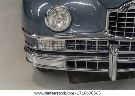 detail of chrome plated front lights bumper  of vintage car. shot at Wanaka, Otago, South Island, New Zealand