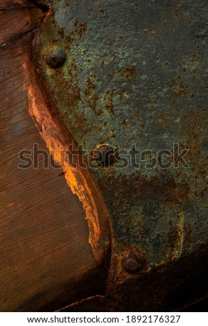 detail of a classic sailing ship coroded with rust