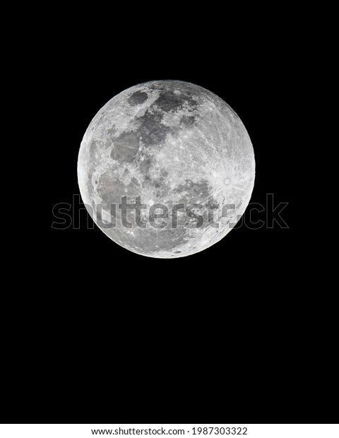 Detail and close up of full moon, is the\
lunar phase when the Moon appears fully illuminated from Earth\'s\
perspective. This occurs when Earth is located between the Sun and\
Moon, lunar hemisphere.