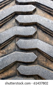 Detail Up Close Of A Tire Tread From A Tractor Or Other Heavy Duty Construction Machinery.