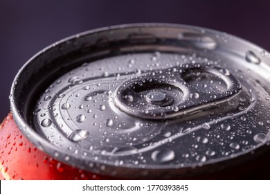 Detail Of Closed Wet Can Of Cold Beer, With Dew And Condensate Water Droplets On The Aluminum Surface