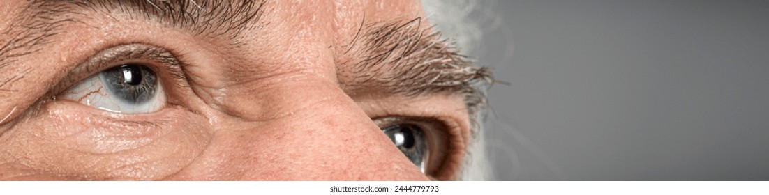 detail close-up macro of elderly man looking up  to  god - Powered by Shutterstock