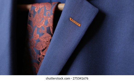 Detail closeup close-up of suit jacket lapel button hole fabric