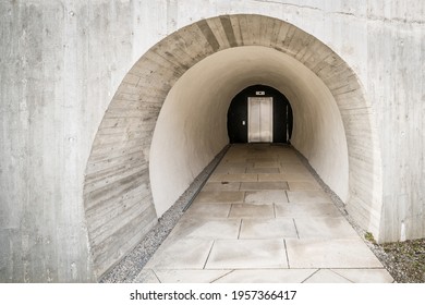 Detail Of A Concrete Carved Into The Rock Access To A Modern Elevator Like That Of A Bunker In The Mountain With Thick Walls, Germany