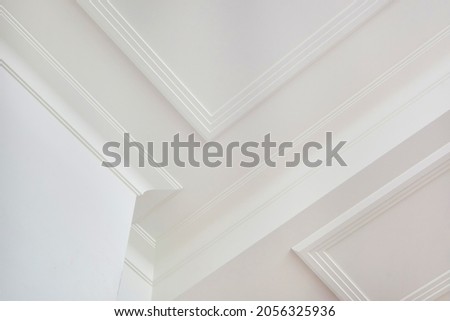 Detail of corner ceiling cornice with intricate crown molding. 
