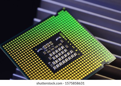 detail of cpu chip processor on aluminum heat sink cooler and lights effects