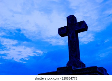 detail of cross on the blue sky