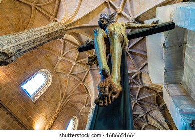 Detail of a crucifix inside the Mosteiro dos Jeronimos in the Belem neighborhood of Lisbon, Portugal. This Manueline style monastery was constructed in the early 16th century.  Jesus Christ on a cross