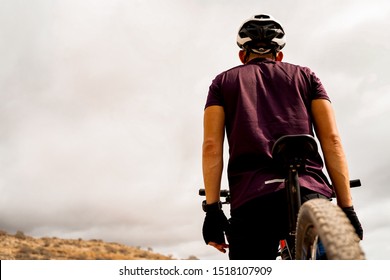 Detail Of Cyclist Man With Mountain Bike On Outdoor. Portrait Of A Man On A Mountain Bike In The Mountains In Cloudy Weather. Mountain Bike And Extreme Sport Concept - Image