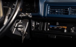 A Detail From The Dashboard Of An Old-fashioned Car, With The Ignition Key Inserted Into The Lock.