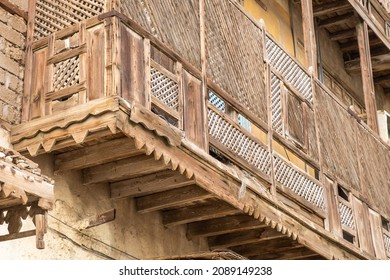 Detail of a decaying wooden balcony on the exterior of a derelict house in the Saudi Arabian city of Yanbu.