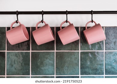 Detail In Decor Interior, Green Tile At Kitchen And Modern Wall Hanging With Hook For Storage Pink Cups Or Kitchenware