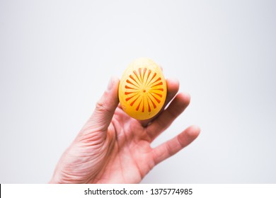 Detail Of Decorated Aster Egg On Hand. White Background, Flat Lay, Top View.