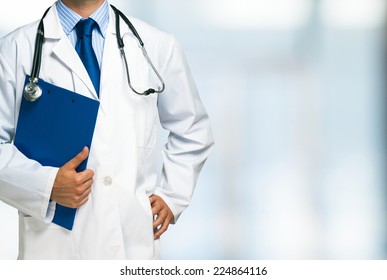 Detail Of A Doctor Holding A Clipboard