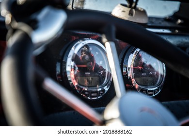 Detail of drivers hands with a speed boat dashboard