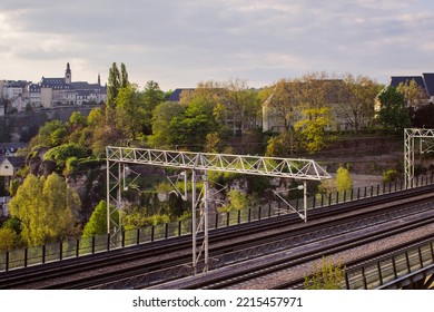 Detail Of Electrical Railroad In Luxembourg City With Rails, Contact Lines And Viaduct Structures In Summer Evening Illustrating Urban Transport Concept, Luxembourg.