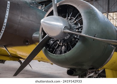 Detail of the engine and propeller of the old plane from the Second World War in a hangar in Normandy, it is the Beechcraft Model 18 Twin Beach - Powered by Shutterstock