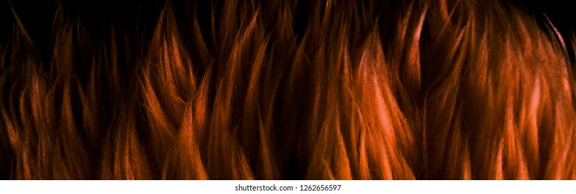 Detail Of Fake Texture Background With Orange Fur, Background Of Artificial Fuzzy Fabric Orange Color, Isolated Beautiful Close Up Of Dark Orange Fake Fur Background, Blurred Orange Fire Burning