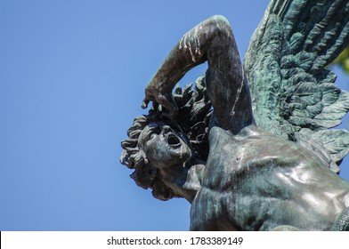 Detail Of Fallen Angel Statue In Madrid