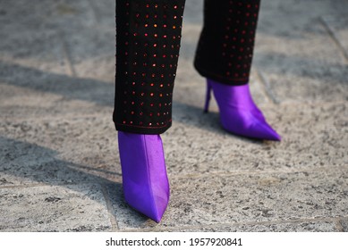 Detail Of A Fashionable Outfit – Woman Wearing Mauve Shoes And Black And Pink Pants