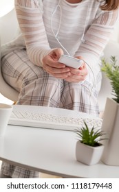 Detail Of Female Hands Holding A Smart Phone, Surfing The Net And Scrolling.