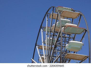 detail of the ferris wheel of the funfair without people by day