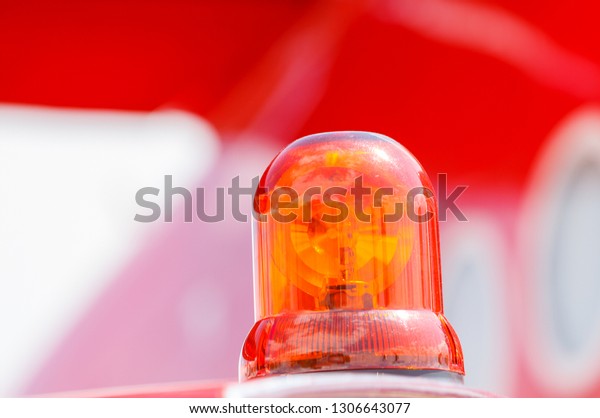 Detail of\
Flashing Red Siren Light on the fire\
truck