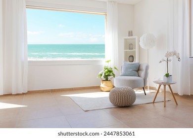 Detail of flat or living room with sea view on a sunny day. Romantic space with large window and armchair and carpet on the left.  There is a feeling of peace and quiet.  - Powered by Shutterstock