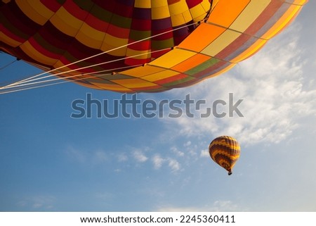 Detail of a flying hot-air balloon. Perspective view from bottom.