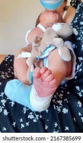 Detail Of The Foot Of A Medicated Newborn After A Blood Draw From The Heel.